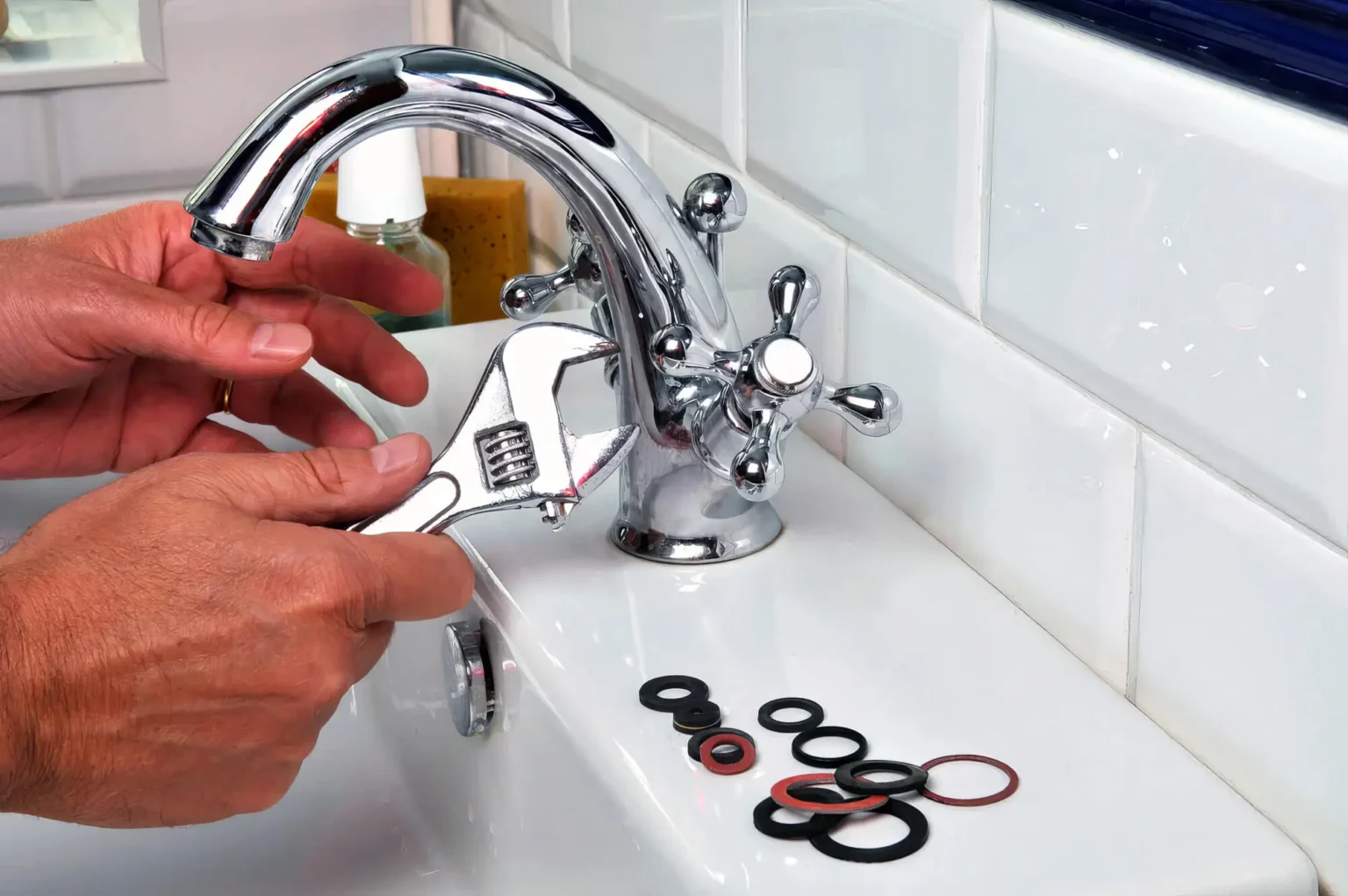 Plumber maintaining a bathroom faucet in Pomona